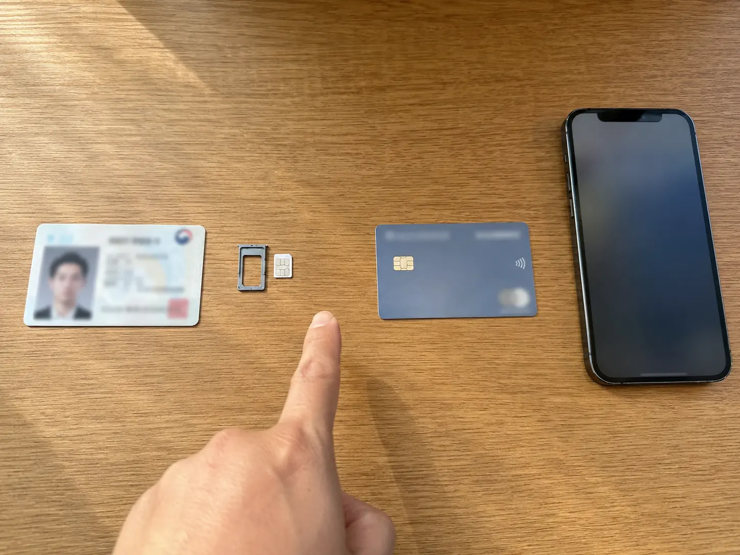 Foreigner at Korean bank counter with documents for banking payments setup